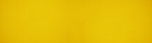 Abstract Yellow Colored Painted Rough Plaster Facade Texture Background Banner Panorama.