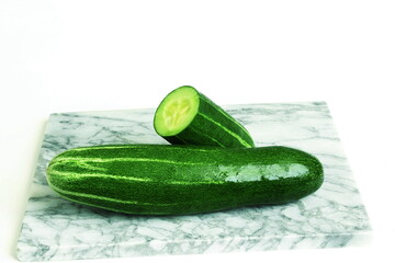 Wall Mural - fresh cucumber cut and whole isolated on white background with copy space