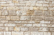 ściana z kamienia w średniowiecznym klimacie  o bezowej kolorystyce.