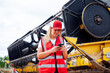 © ADDICTIVE STOCK - Woman having phone call near combine harvester
