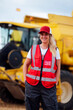 © ADDICTIVE STOCK - Content woman standing near combine harvester