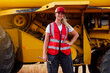 © ADDICTIVE STOCK - Positive woman with wrench near combine harvester
