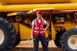 © ADDICTIVE STOCK - Positive woman with wrench near combine harvester