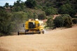 © ADDICTIVE STOCK - Combine harvester driving on agricultural field