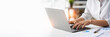 © crizzystudio - Crop shot of woman hand works on laptop Bookkeeper or financial inspector hands with copy space making the report and calculating. Home finances, investment, economy, or insurance concept