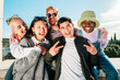 © Jose Calsina - Multiracial group of friends smiling posing in front of the camera for a picture.
