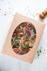 Wall Mural - Canape snack with exotic meat, sliced salmon fish, capers packed in cardboard box for delivery catering service. Delicious set of snacks