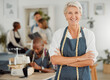 © Kay A/peopleimages.com - Confident senior female clothing production teacher smiling at her success. Proud modern fashion entrepreneur starting a business. Portrait of an old woman giving tailor job training to adults