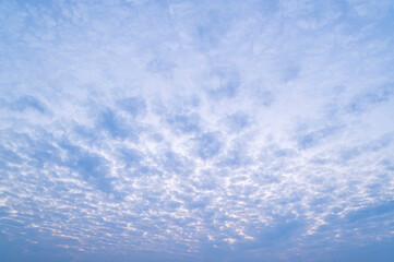 sunset or sun rise sky with rays of light shining clouds and sky background and texture