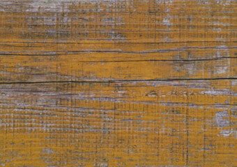 Wall Mural - Layers of old chipped yellow, blue and white paint in cracks on a wooden surface. Removing flooring from boards. Repair in the household. Soft focus.