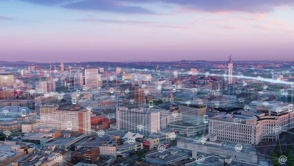 aerial view drone of birmingham england,motion graphic animation of smart city communication connection symbols or icons growing over cityscape,urban telecommunication network