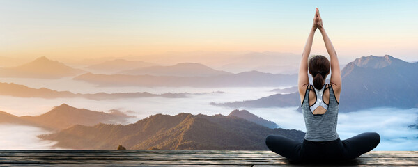 Young woman practicing yoga in the nature