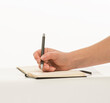 © serhii - hand with a pen writes close-up isolated on a white background