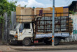 © milkovasa - An old truck loaded with cardboard is parked on the sidewalk