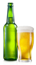 Opened Green Bottle Of Cold Beer With Beer Glass Isolated On A White Background. File Contains Clipping Path.