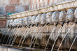 Famous mediaeval Fountain of 99 Spouts in ithe old town of L'Aquila, Italy