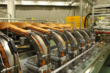 A lot of cookies on the production line. The flow of sweets before packaging. Packing crackers on the machine. Innovative production.