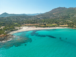 Wall Mural - Aerial view of the clear turquoise Mediterranean sea at Bodri beach in the Balagne region of Corsica