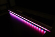 Pink and purple LED lamp for greenhouse on the table, close up