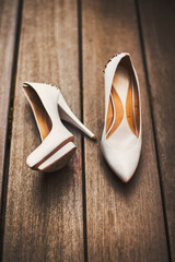 Wall Mural - Wedding shoes stand on a wooden floor