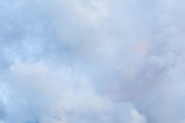 Wall Mural - Cloudy sky background with pale pink clouds at sunset