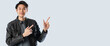© whyframeshot - young attractive smart male wear jacket casual cloth standing hand finger point to the air for copy space,portrait of asian male presenter show finger point direction to corner white background