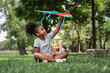 African American kid girl play kite in the park