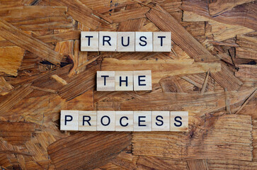 trust the process text on wooden square, motivation quotes