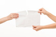 © serhii - two pairs of female hands hands hold pull in different directions tear a blank sheet of paper document on a white background isolated