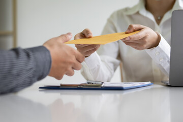 Businessman picking up and delivering documents in the office.