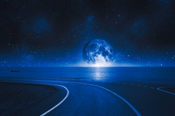 Wall Mural - asphalt road and seascape at full moon at night sky