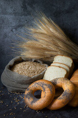 top view of sliced wholegrain bread on dark ructic wooden background closeup. various tasty breads w