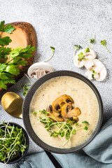 Wall Mural - Mushroom Soup on light stone table. Top view with copy space.