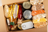 Fototapeta  - Survival set of nonperishable foods in carton box