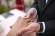 © tsezarina - Bride and groom exchange rings at the wedding ceremony