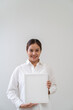 © littlestocker - Asian woman holding white board. Advertising copyspace