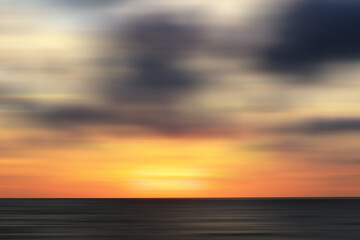 Wall Mural - abstract blurred sunset at the beach