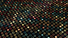 Moving Surface With Many Small Round Shaped Silhouettes And Colorful Blinking Circles Inside Them, Seamless Loop. Animation. Light Flares Flowing All Over The Black Screen, Concept Of Energy.