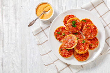 Wall Mural - mini pizzas with ham and pecorino cheese, top view