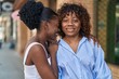 © Krakenimages.com - African american women mother and daughter hugging each other at street