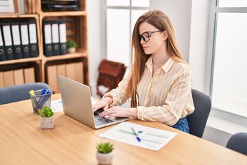 Canvas Print - Young blonde woman business worker using laptop working at office