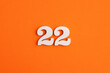 Number 22 - On orange foam rubber background