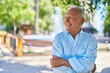 © Krakenimages.com - Senior grey-haired man smiling confident standing with arms crossed gesture at park