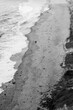 © Petr - Black and white aerial shot of single person walking along the coastline. Person walking on a sandy beach of Helgoland island, Germany. Concept for wandering, solitude, meditation, meaning of life.
