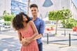 © Krakenimages.com - Man and woman couple smiling confident hugging each other standing at street