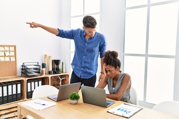 Wall Mural - Man and woman business workers firing employee at office