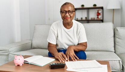 Sticker - Senior african american woman smiling confident controlling economy at home