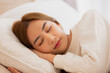 © sopradit - Asian women sleeping and sweet dream on white bed in bedroom