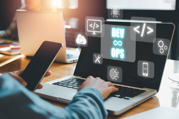 DevOps concept, Woman hand using laptop computer with DevOps icon on VR screen on desk, Methodology development operations agil programming technology concept.