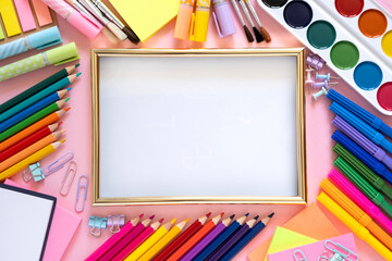 Frame and stationery, supplies - pencil, felt-tip pen, paints. Back to school concept. Copy space, top view, flat lay.